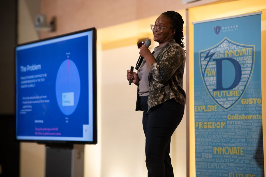 Dr. Tamu at the pitch competition stage at Draper University